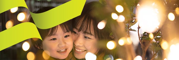 mother and child looking at lights