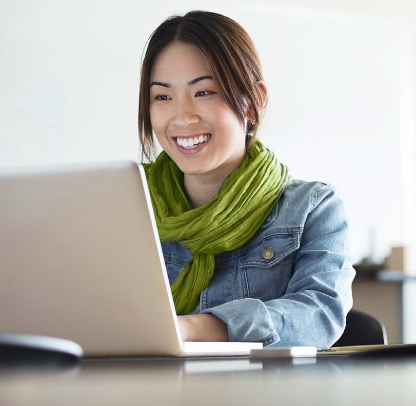 Woman smiling at her computer