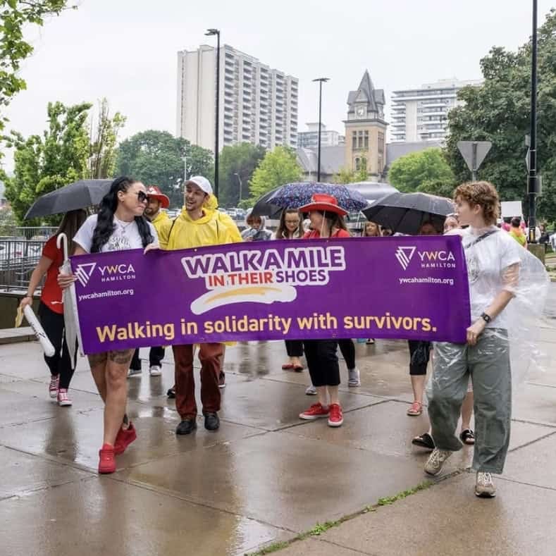 People walking with a banner