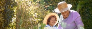 Grandma and grandchild gardening