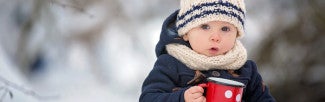 Kid in Winter with a cup