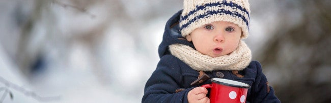 Kid in Winter with a cup