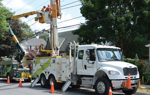 Workers in an Alectra Utility Truck fixing power lines