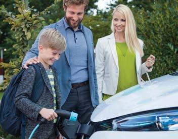 a family plugging in their electric vehicle
