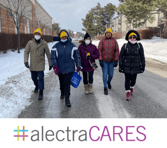 AlectraCARES team walking on a icy road.
