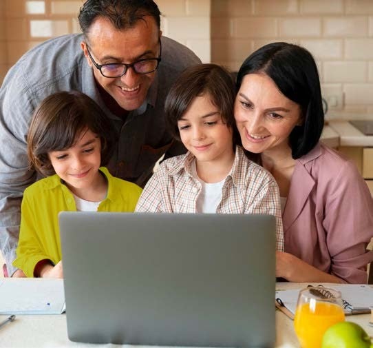 Family of four using a computer
